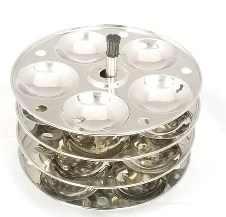 Metallic three-tiered stand with circular compartments on a white background