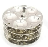 Metallic three-tiered stand with circular compartments on a white background