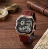 Casio digital watch with brown leather strap on a wooden surface