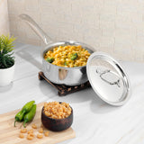 Stainless steel pot with macaroni and broccoli on a kitchen counter